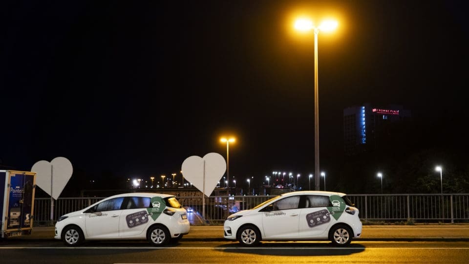 GreenMobility cars in a row at night
